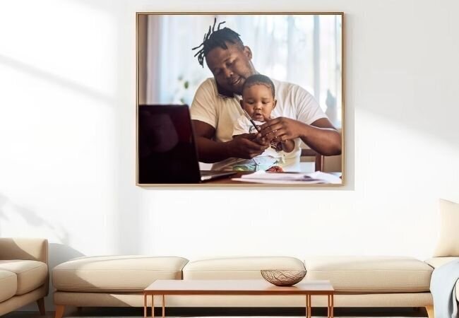 Father and son sharing breakfast and working from home.